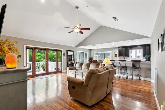 4321 San Remo Rd, New Orleans, LA 70129 - living room with ceiling fan, wood-type flooring, baseboards, and high vaulted ceiling