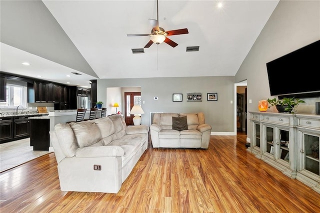 4321 San Remo Rd, New Orleans, LA 70129 - living room with high vaulted ceiling, a ceiling fan, light wood-type flooring, and recessed lighting