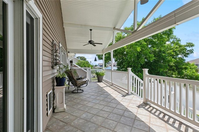 4321 San Remo Rd, New Orleans, LA 70129 - covered porch with a ceiling fan