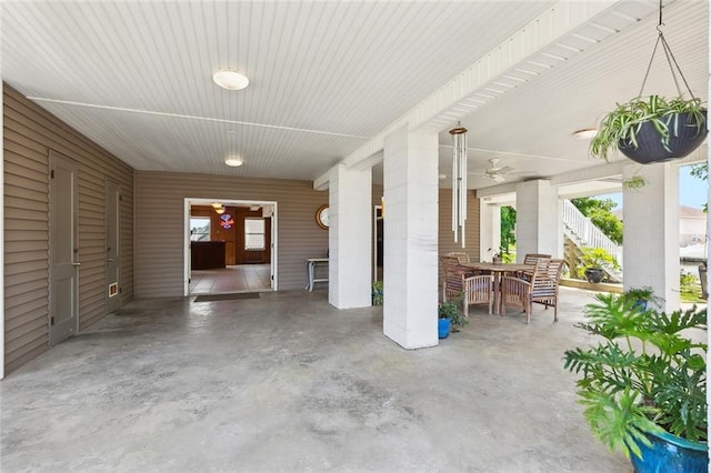 4321 San Remo Rd, New Orleans, LA 70129 - view of patio / terrace with stairway, a carport, and outdoor dining area