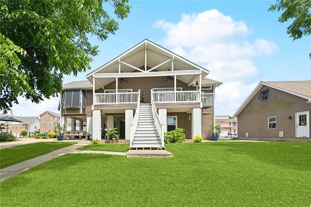 4321 San Remo Rd, New Orleans, LA 70129 - rear view of property with a ceiling fan, stairway, a lawn, and a wooden deck