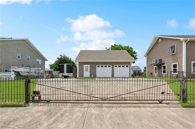 4321 San Remo Rd, New Orleans, LA 70129 - view of front of home featuring an outdoor structure, a gate, a detached garage, and concrete driveway