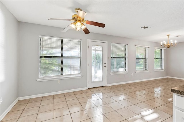 206 Chubasco Ln, Slidell, LA 70458 - entrance foyer featuring a chandelier, light tile patterned flooring, ceiling fan, and baseboards