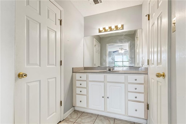 206 Chubasco Ln, Slidell, LA 70458 - bathroom with vanity, ceiling fan, and baseboards