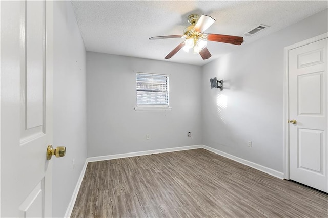 206 Chubasco Ln, Slidell, LA 70458 - spare room featuring a ceiling fan, wood finished floors, a textured ceiling, and baseboards