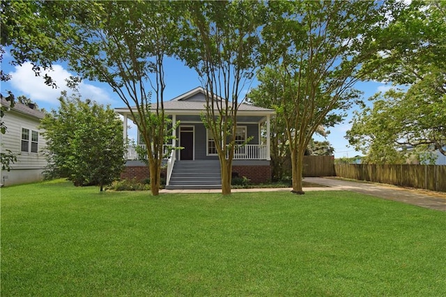 105 Norton Ave, Arabi, LA 70032 - view of front of house featuring covered porch