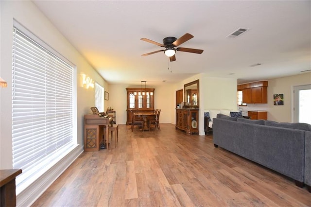 206 Loop Dr, Slidell, LA 70458 - living room featuring a ceiling fan and light wood-style floors