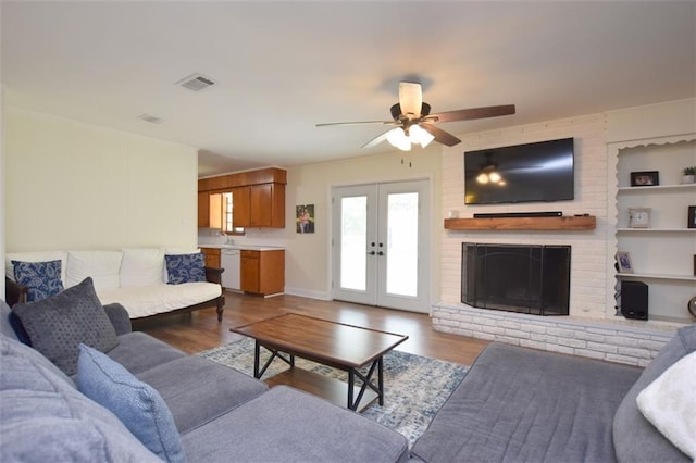 206 Loop Dr, Slidell, LA 70458 - living area featuring wood finished floors, a ceiling fan, french doors, and baseboards