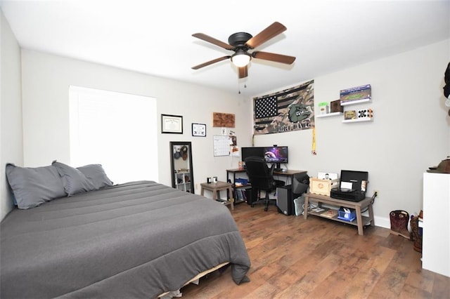 206 Loop Dr, Slidell, LA 70458 - bedroom featuring wood finished floors, ceiling fan, and an office area