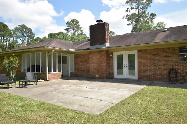206 Loop Dr, Slidell, LA 70458 - rear view of house with a chimney, french doors, a patio area, and brick siding