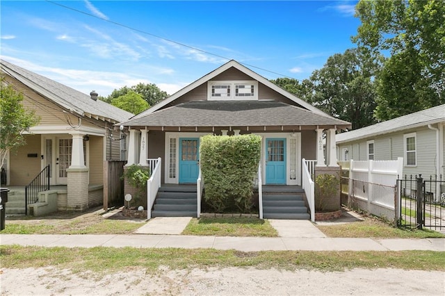182527 Cambronne St, New Orleans, LA 70118 - view of front of house with a porch and roof with shingles