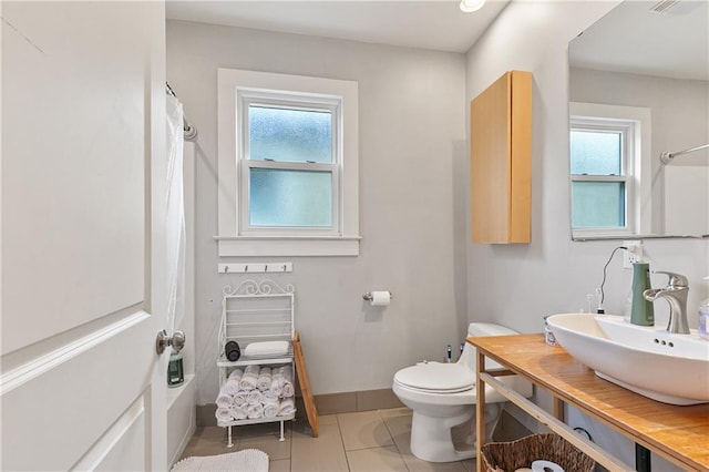 182527 Cambronne St, New Orleans, LA 70118 - full bathroom featuring healthy amount of natural light, vanity, baseboards, and toilet