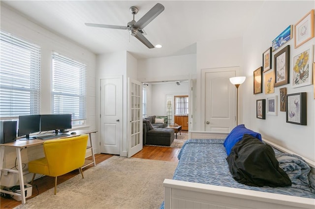 182527 Cambronne St, New Orleans, LA 70118 - bedroom with light wood-style flooring, an office area, and ceiling fan