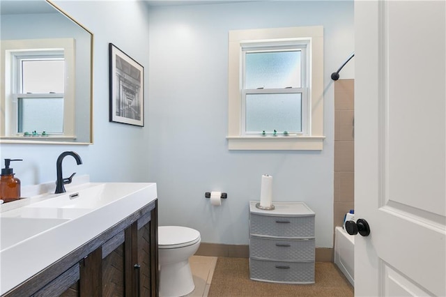 182527 Cambronne St, New Orleans, LA 70118 - full bathroom with toilet, vanity, baseboards, and tub / shower combination