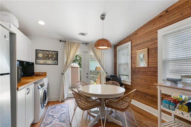 182527 Cambronne St, New Orleans, LA 70118 - dining space featuring wood walls, light wood finished floors, baseboards, and recessed lighting