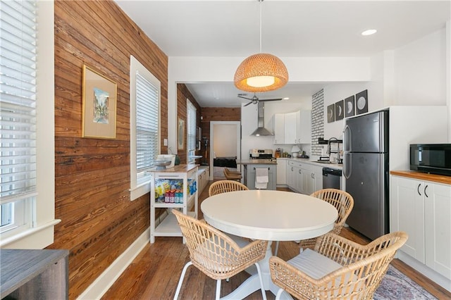 182527 Cambronne St, New Orleans, LA 70118 - dining space featuring wooden walls and wood finished floors
