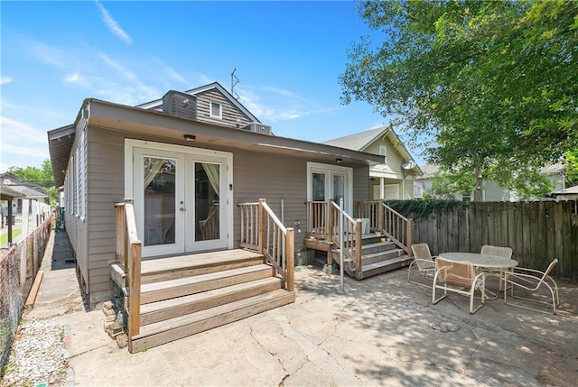 182527 Cambronne St, New Orleans, LA 70118 - rear view of house with french doors, a patio, and a fenced backyard