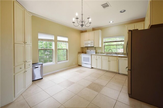 109 Norton Ave, Arabi, LA 70032 - kitchen featuring white appliances, ornamental molding, a chandelier, plenty of natural light, and a sink
