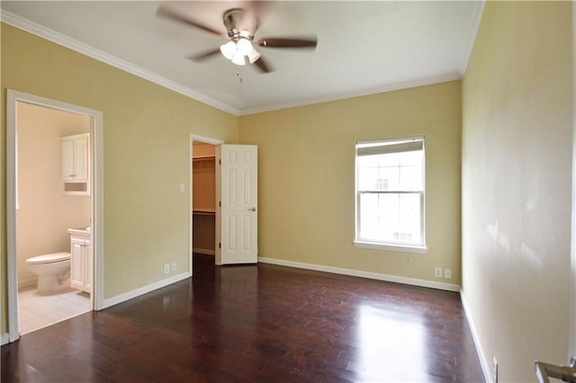 109 Norton Ave, Arabi, LA 70032 - unfurnished bedroom with crown molding, a spacious closet, wood finished floors, connected bathroom, and baseboards