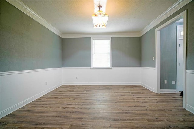 115 Devereux Dr, Slidell, LA 70461 - empty room featuring crown molding, wood finished floors, a chandelier, and a textured ceiling