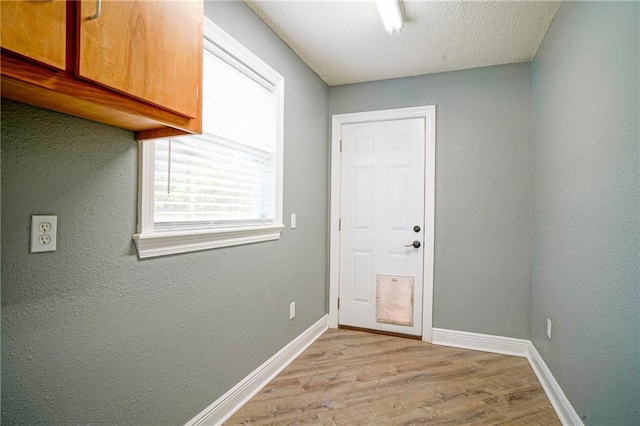 115 Devereux Dr, Slidell, LA 70461 - doorway featuring wood finished floors and baseboards