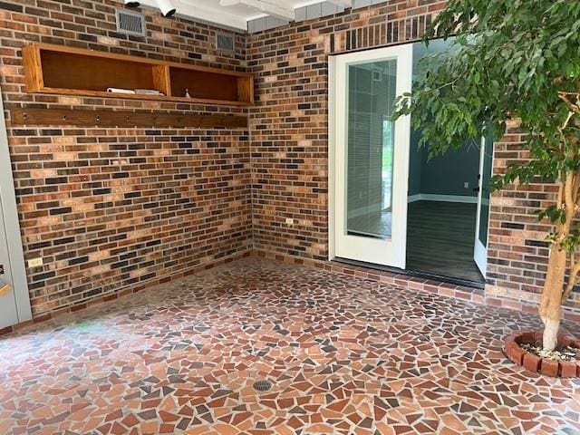 115 Devereux Dr, Slidell, LA 70461 - property entrance with brick siding and a patio