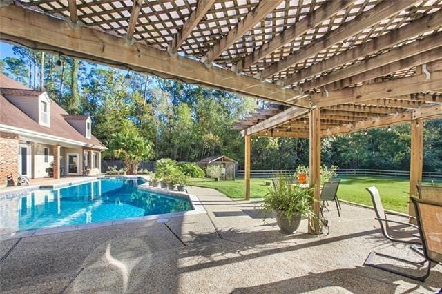 115 Devereux Dr, Slidell, LA 70461 - view of swimming pool featuring a patio, a pergola, and view of scattered trees