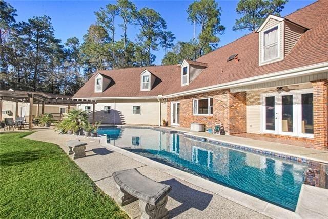 115 Devereux Dr, Slidell, LA 70461 - swimming pool featuring a pergola, french doors, a patio, and a yard