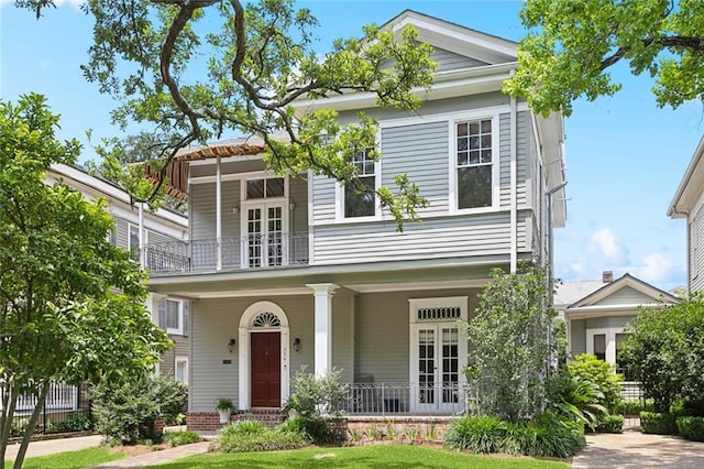 39294 Broadway St, New Orleans, LA 70118 - view of front facade featuring a balcony, covered porch, and french doors