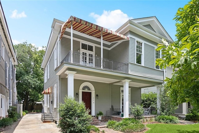 39294 Broadway St, New Orleans, LA 70118 - view of front facade featuring a balcony and a porch