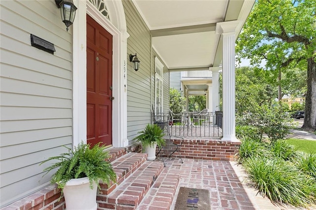 39294 Broadway St, New Orleans, LA 70118 - doorway to property featuring a porch