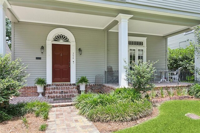 39294 Broadway St, New Orleans, LA 70118 - view of exterior entry featuring a porch