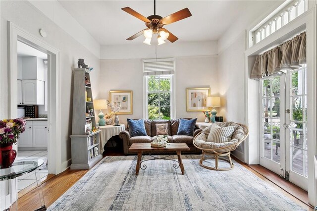 39294 Broadway St, New Orleans, LA 70118 - living area featuring ceiling fan, light wood finished floors, and french doors