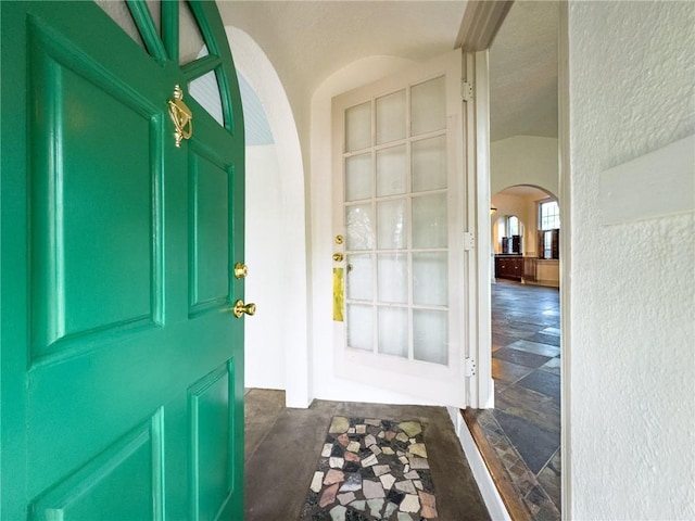 2508 Joseph St, New Orleans, LA 70115 - entrance foyer featuring arched walkways and a textured wall