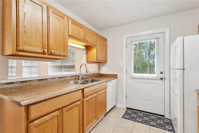 2986 Camellia Dr, Slidell, LA 70458 - kitchen with white appliances, a sink, and light tile patterned floors