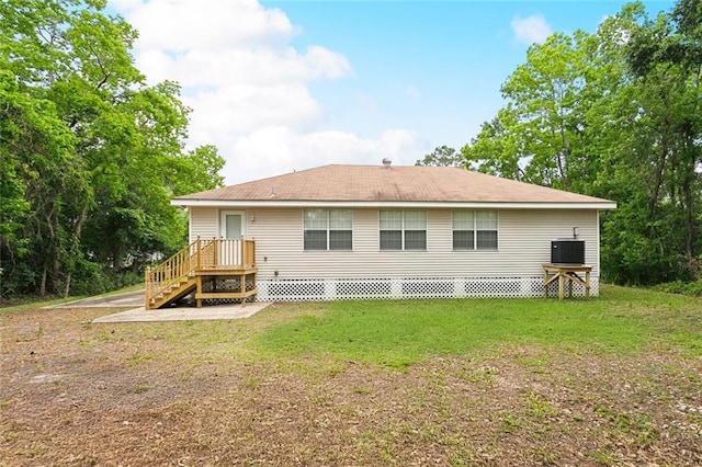 2986 Camellia Dr, Slidell, LA 70458 - back of house with cooling unit and a lawn