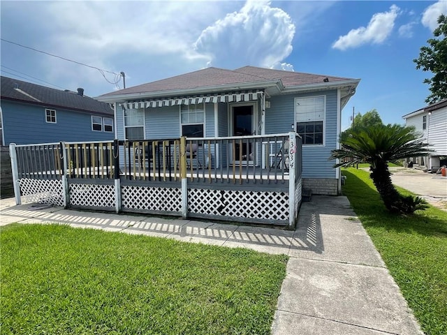3034 Clouet St, New Orleans, LA 70126 - rear view of property with a yard and roof with shingles