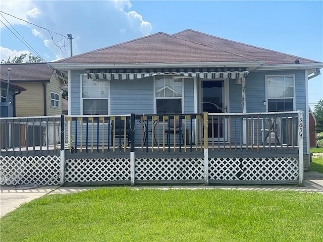 3034 Clouet St, New Orleans, LA 70126 - back of property featuring a yard and a wooden deck