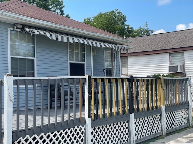 3034 Clouet St, New Orleans, LA 70126 - rear view of property with a deck, roof with shingles, and cooling unit
