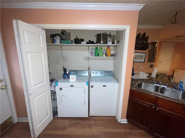3034 Clouet St, New Orleans, LA 70126 - washroom featuring ornamental molding, separate washer and dryer, dark wood-type flooring, and baseboards