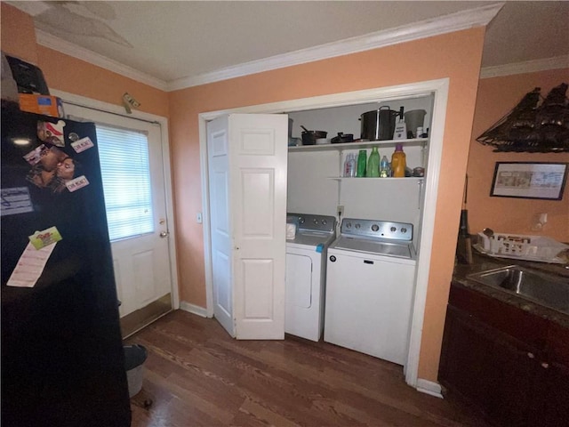 3034 Clouet St, New Orleans, LA 70126 - washroom featuring washing machine and clothes dryer, dark wood-style flooring, and crown molding