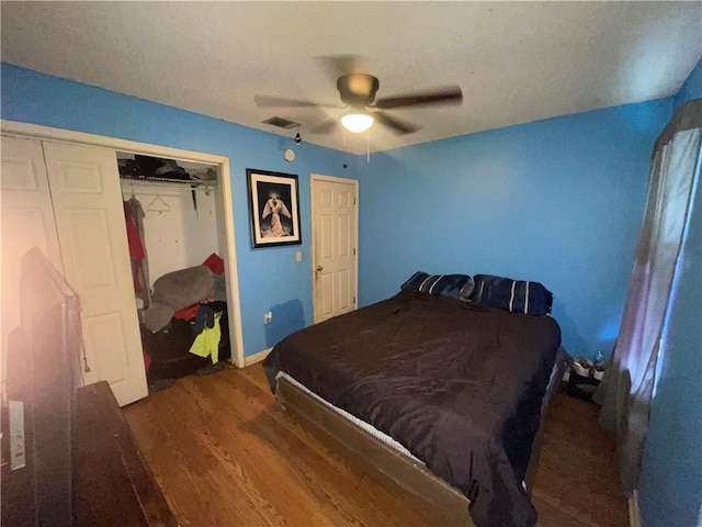 3034 Clouet St, New Orleans, LA 70126 - bedroom featuring wood finished floors, a ceiling fan, a closet, and baseboards