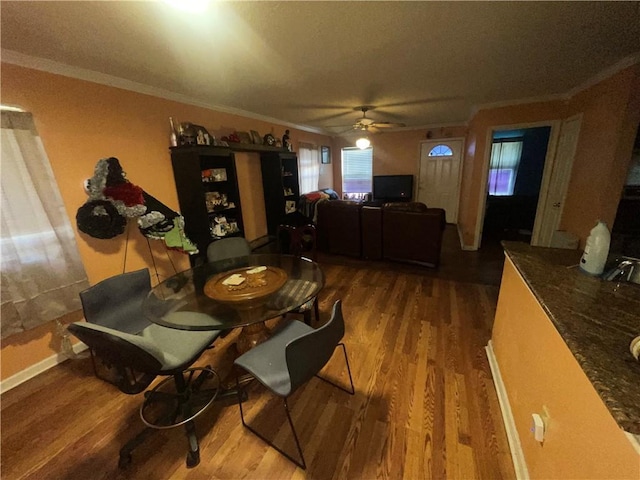 3034 Clouet St, New Orleans, LA 70126 - dining room featuring wood finished floors, ornamental molding, and ceiling fan