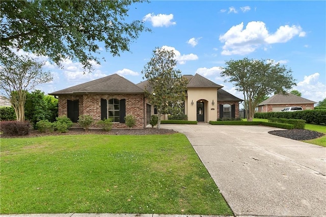 103 Lac Cypriere Dr, Luling, LA 70070 - view of front of property with a front lawn, curved driveway, and brick siding