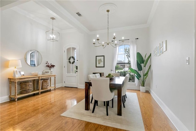 103 Lac Cypriere Dr, Luling, LA 70070 - dining room with a chandelier, light wood-style flooring, crown molding, and baseboards