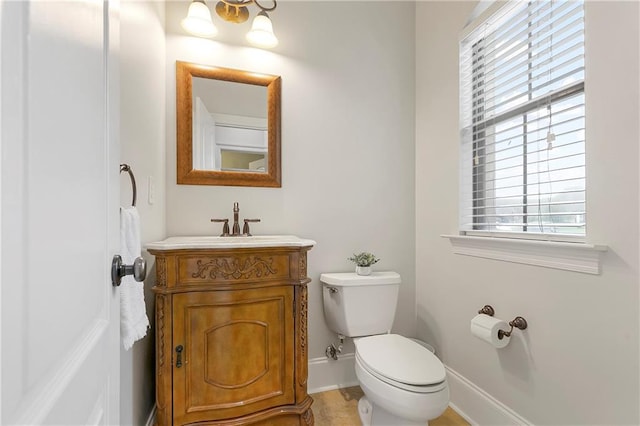 103 Lac Cypriere Dr, Luling, LA 70070 - bathroom featuring toilet, vanity, baseboards, and healthy amount of natural light