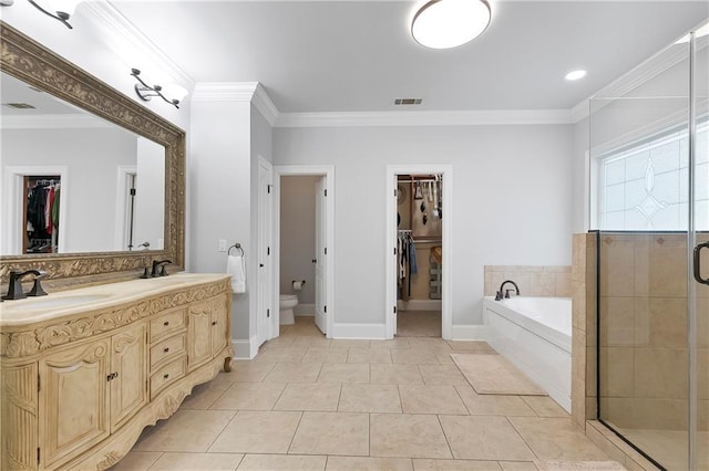 103 Lac Cypriere Dr, Luling, LA 70070 - bathroom with a walk in closet, a bath, double vanity, crown molding, and a shower stall