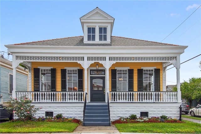 4628 Cleveland Ave, New Orleans, LA 70119 - view of front of house featuring a porch and a shingled roof