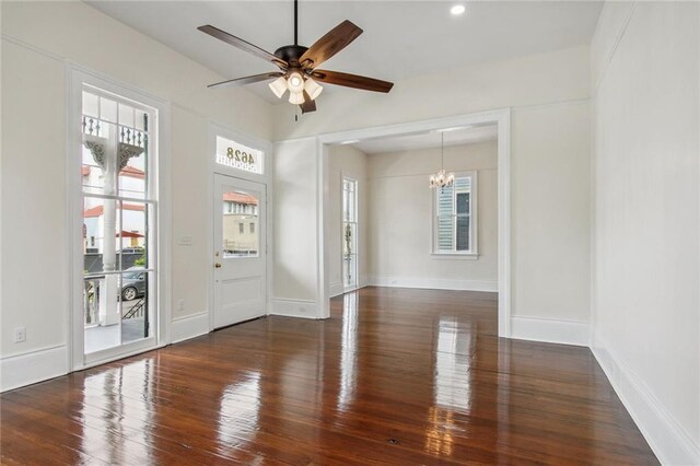 4628 Cleveland Ave, New Orleans, LA 70119 - empty room with a chandelier, wood finished floors, ceiling fan, and baseboards