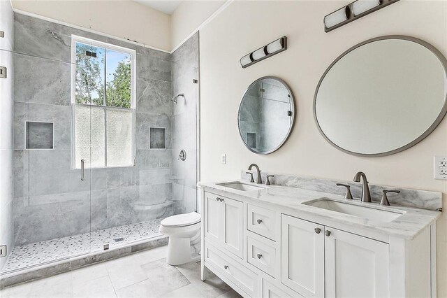 4628 Cleveland Ave, New Orleans, LA 70119 - full bathroom featuring toilet, a stall shower, and double vanity